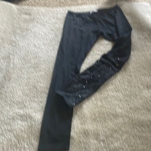 Young girls, black leggings, brand, new styling and patent on the right leg.